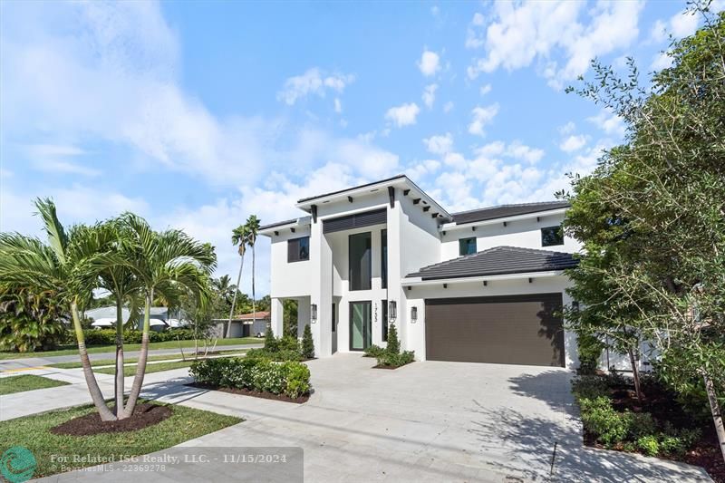 Home faces south with large circular driveway