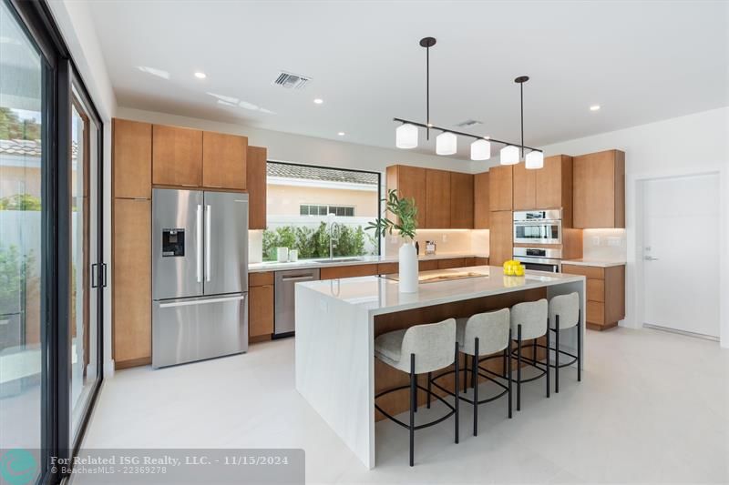 Large picture window at sink making kitchen open and airy