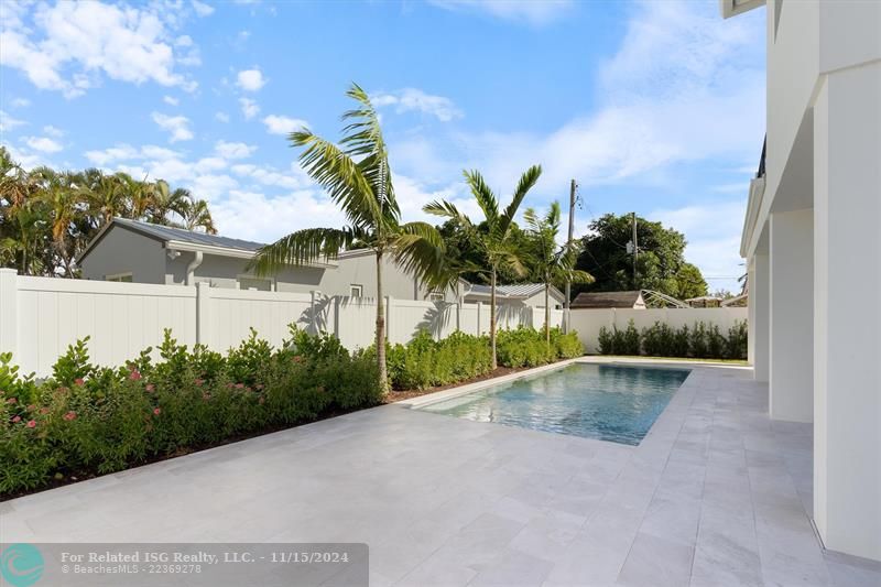 West view of pool and deck area.