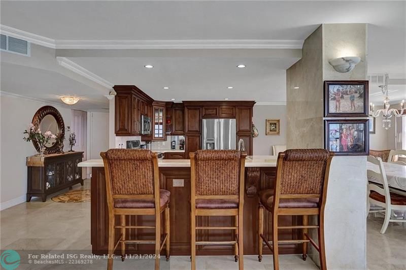 The door to the right of the bureau and the mirror is a closet. The front entry way double doors are after that.