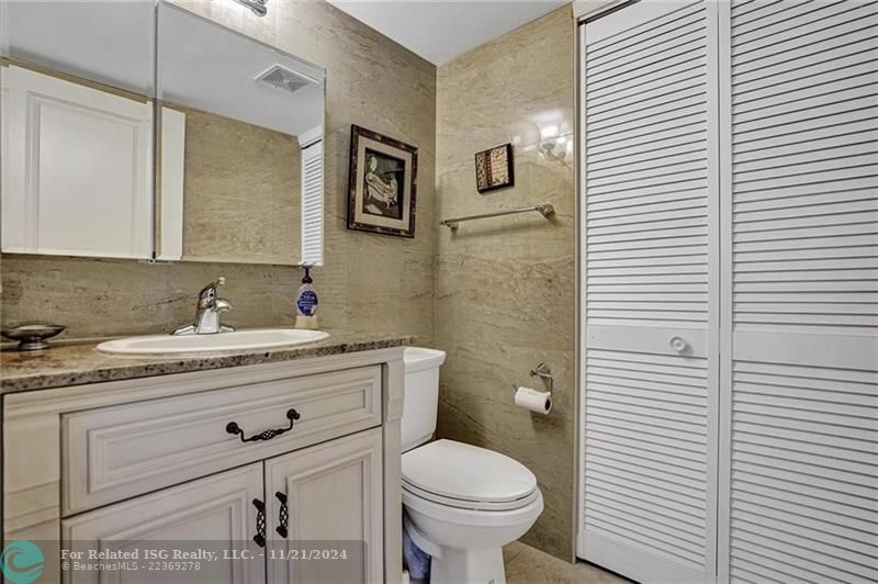 The half bathroom houses the washer and dryer.