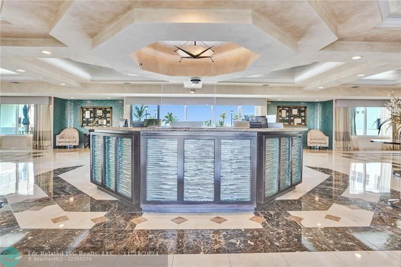 Southpoint has 24/7 security. The two luxury high rise towers are connected by this lovely lobby. A view out to the beautiful pool deck is visible.