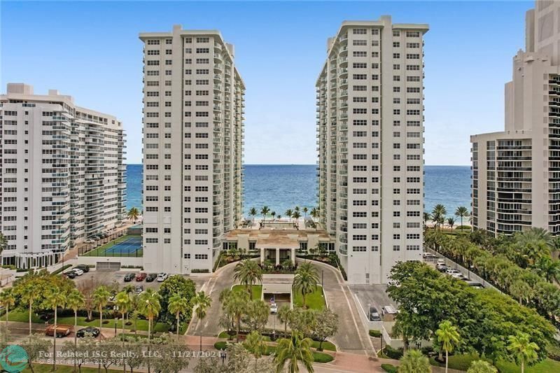 All apartments at Southpoint have assigned garage parking spaces. The pool deck is between the two towers. The oceanfront tennis court is to the left of the north tower.