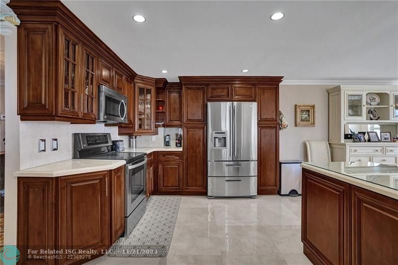 The kitchen has stainless appliances and plenty of cabinet space.