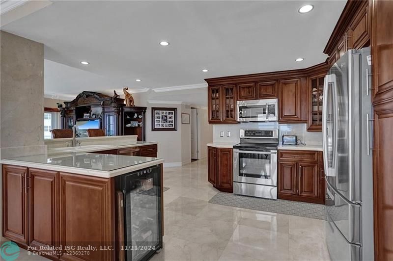 The kitchen has stainless appliances and plenty of cabinet space.