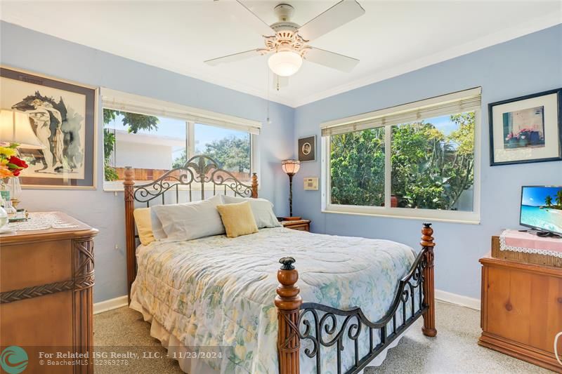 Bedroom with Impact Windows and crown molding