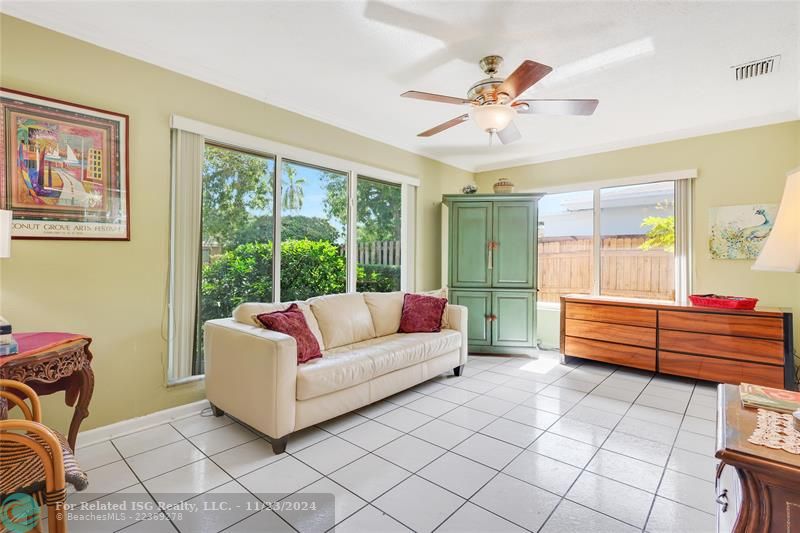 Spacious living room with lots of light and crown Molding.