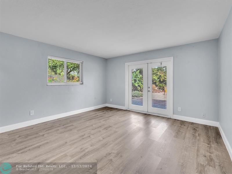 Primary Bedroom with Door to Pool Area