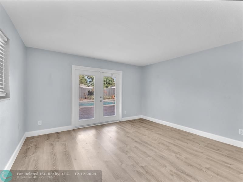 Primary Bedroom with Door to Pool Area