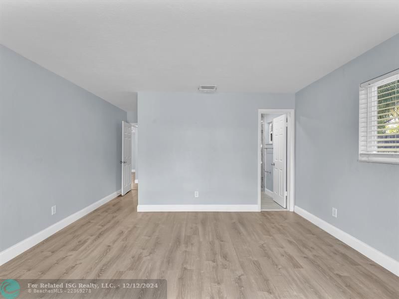 Primary Bedroom with Door to Pool Area