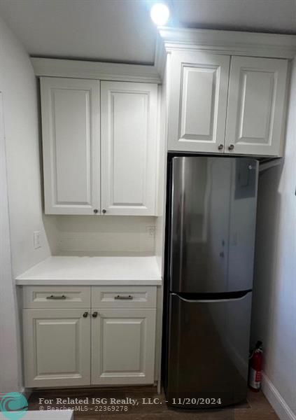 New white cabinets and stainless steel appliances