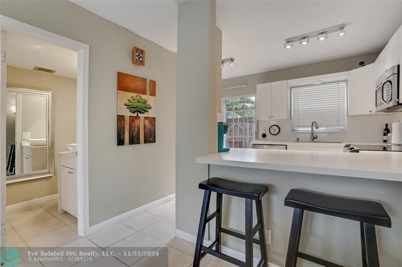 Kitchen and entry to half bath