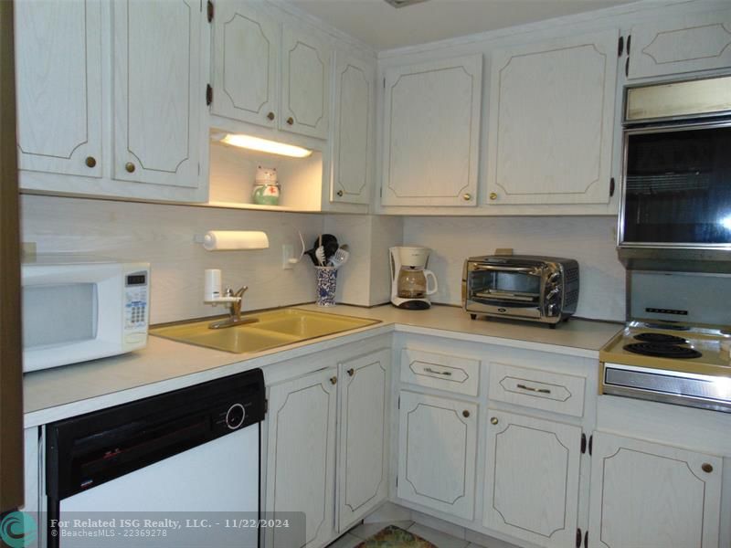 THE WASHER DRYER IS INSIDE THE CABINET