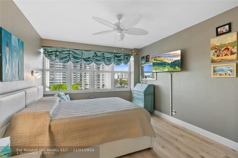 Primary bedroom set up as office with murphy bed.