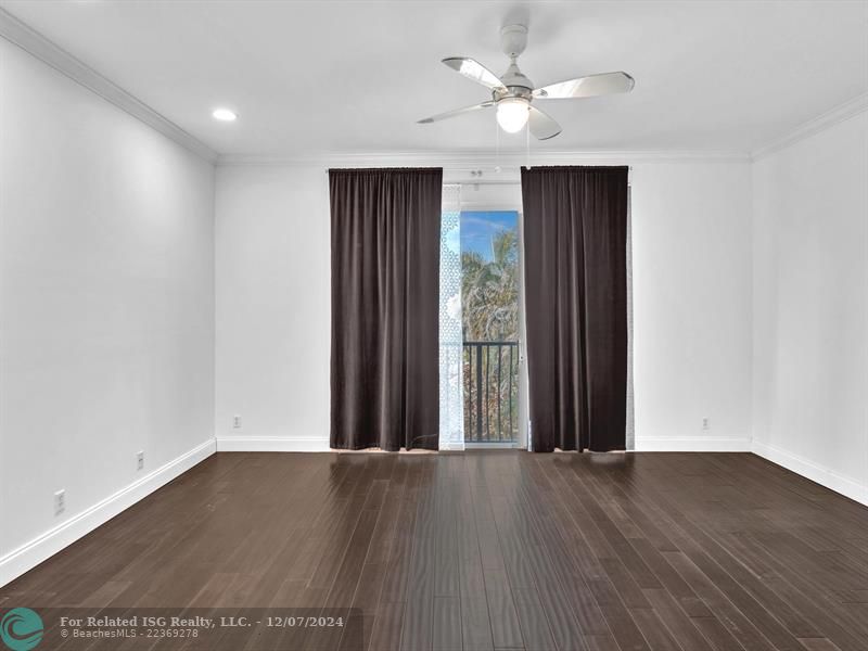 entrance to main bedroom with walk in on right and large bath on left