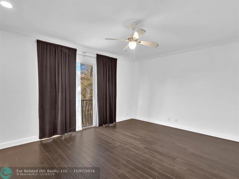 entrance to main bedroom with walk in on right and large bath on left