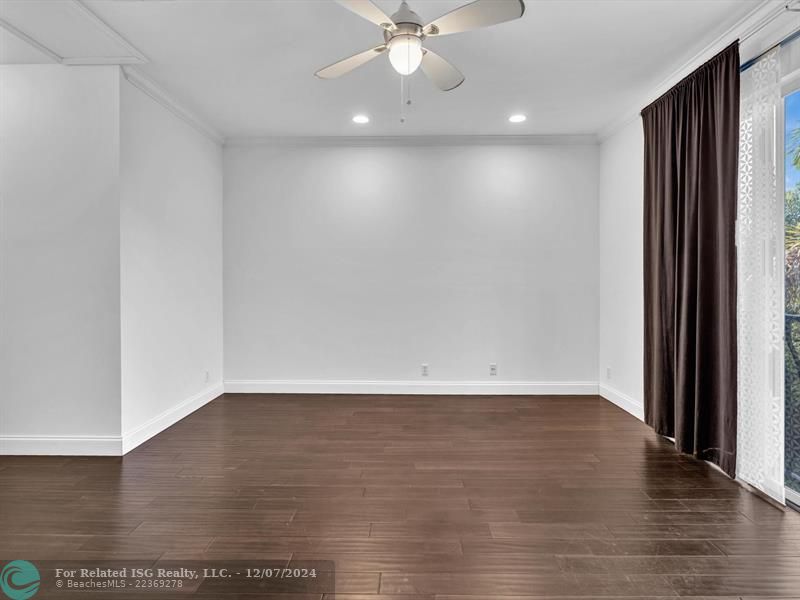 entrance to main bedroom with walk in on right and large bath on left