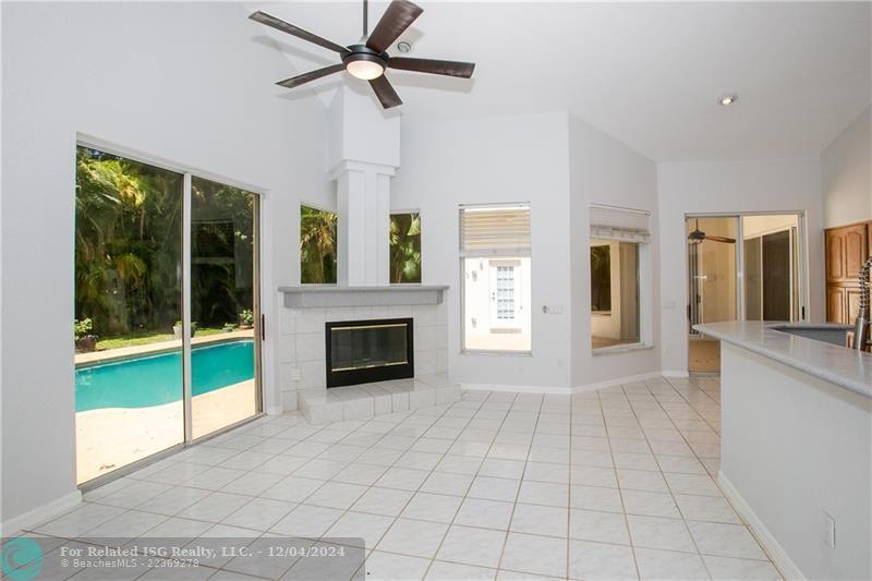 Large open formal living facing patio/pool