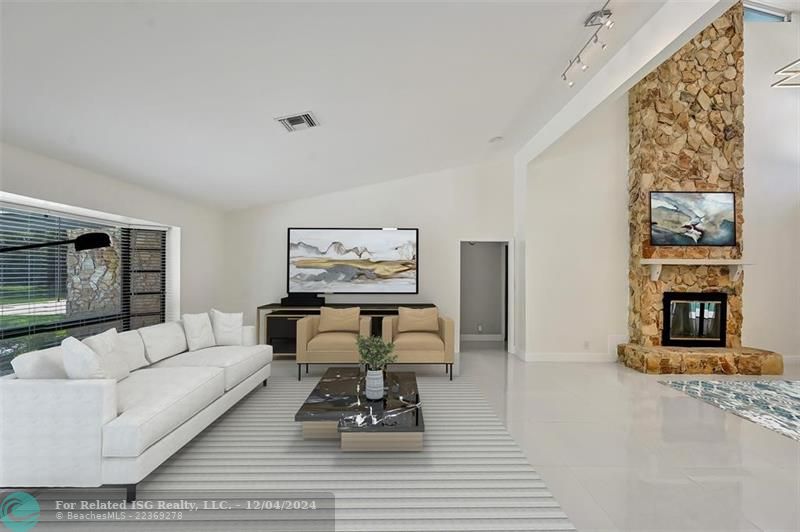 Living room area, with vaulted ceiling.