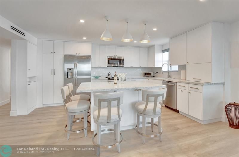 Quartz counters and stainless appliances in a sophisticated look