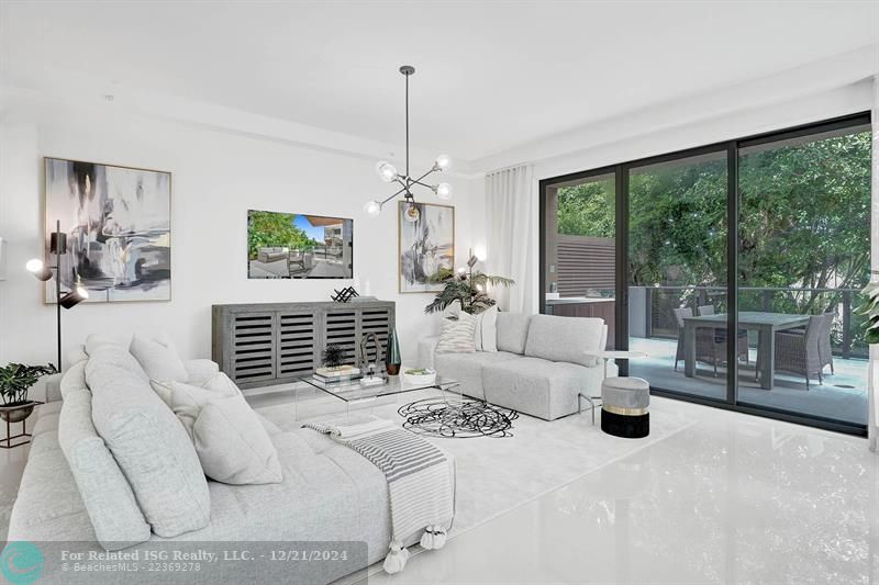 Corner townhouse-condo with floor-to-ceiling windows.