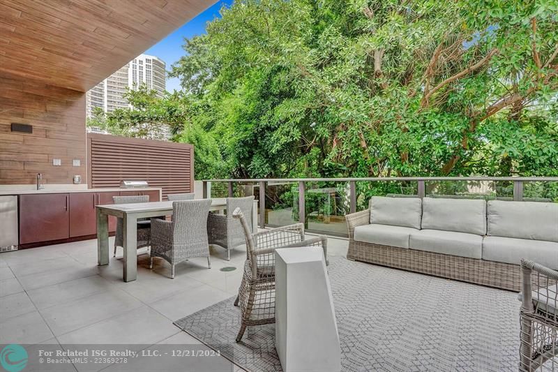 Corner townhouse-condo with floor-to-ceiling windows.