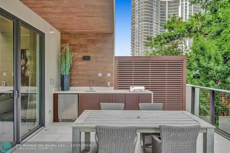 Corner townhouse-condo with floor-to-ceiling windows.