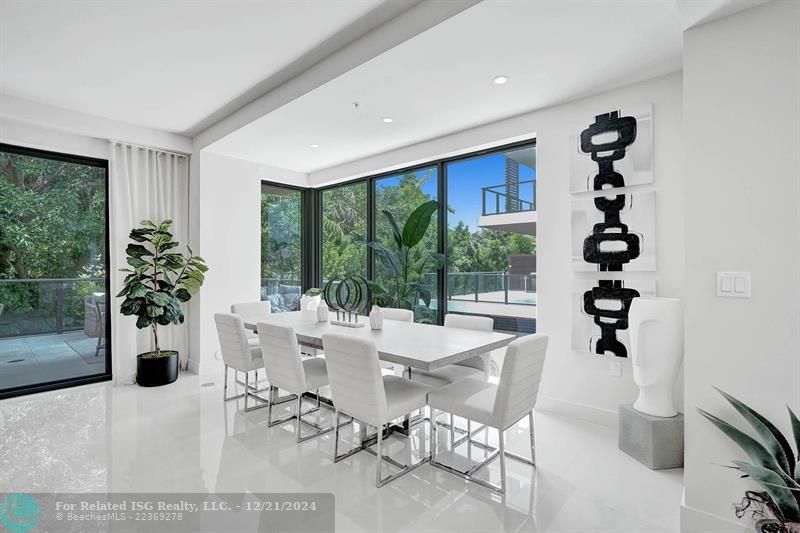 Corner townhouse-condo with floor-to-ceiling windows.