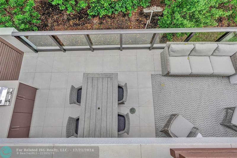 View of the living room balcony from primary bedroom balcony