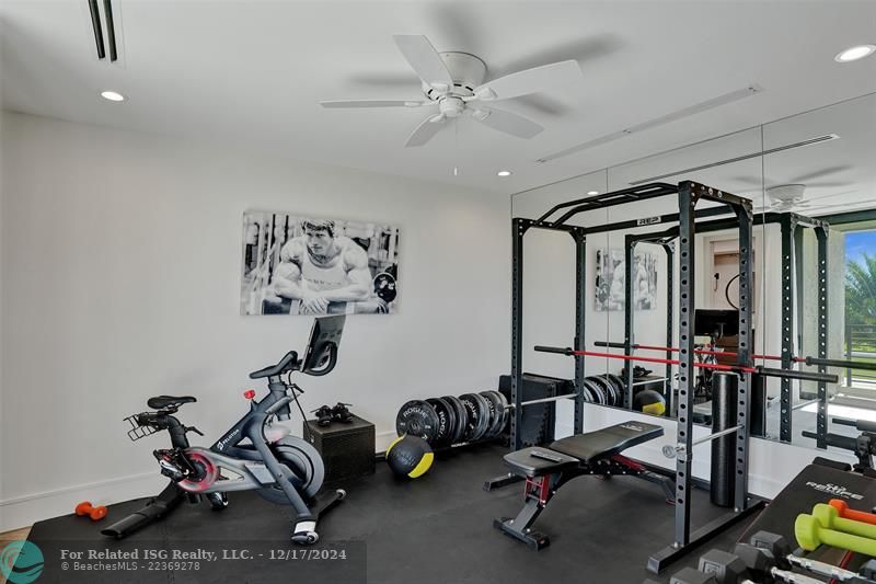 Gym off master bedroom with adjoining 1/2 bath.