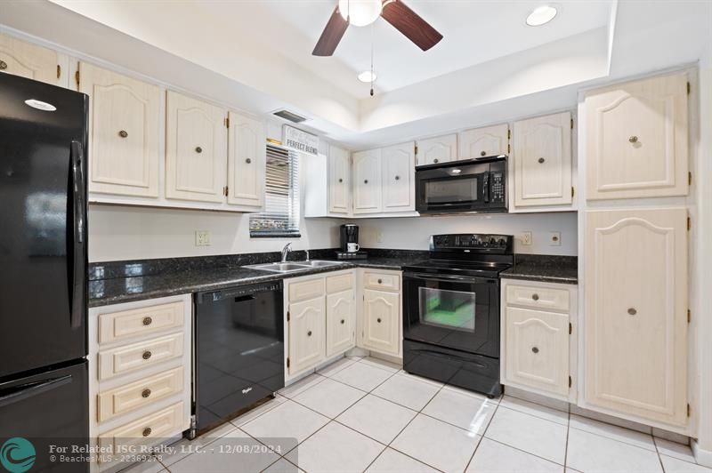 The kitchen has a window above the sink