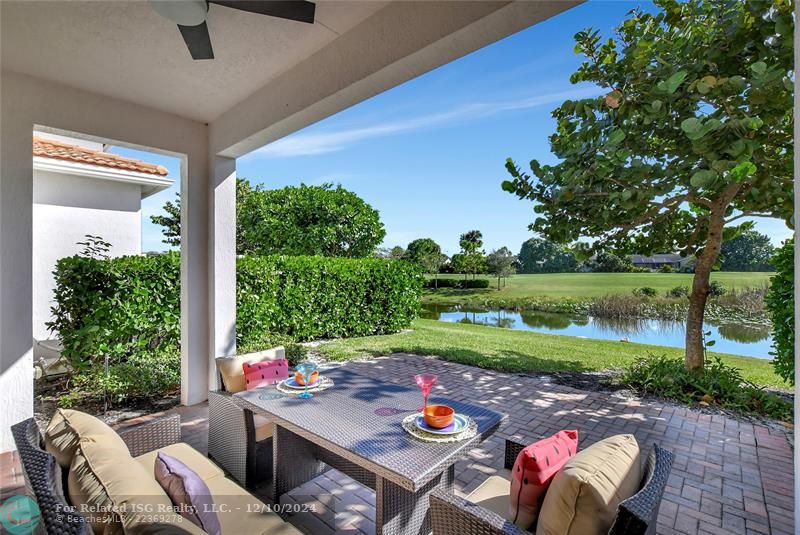 Peaceful water and manicured golf views from your private patio.