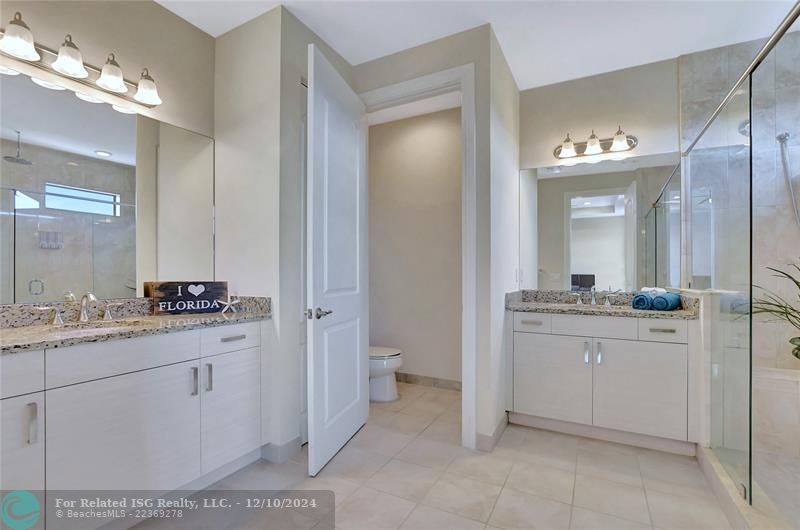 Gorgeous primary bath! Enjoy the split vanities with granite counters and under mount sinks.