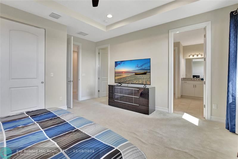 Primary bedroom has two closets-perfect for fashion fans.