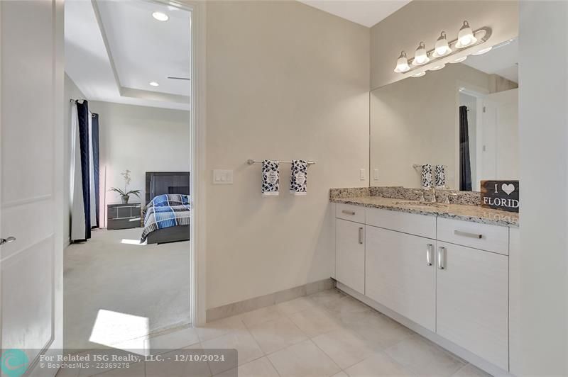 Split vanities with granite counters and undermount sinks.