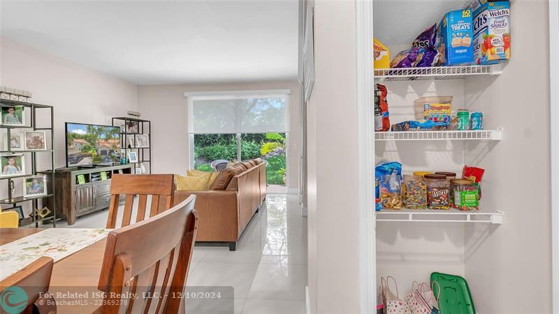 Granie snack counters and ample cabinets in this bright eat in kitchen