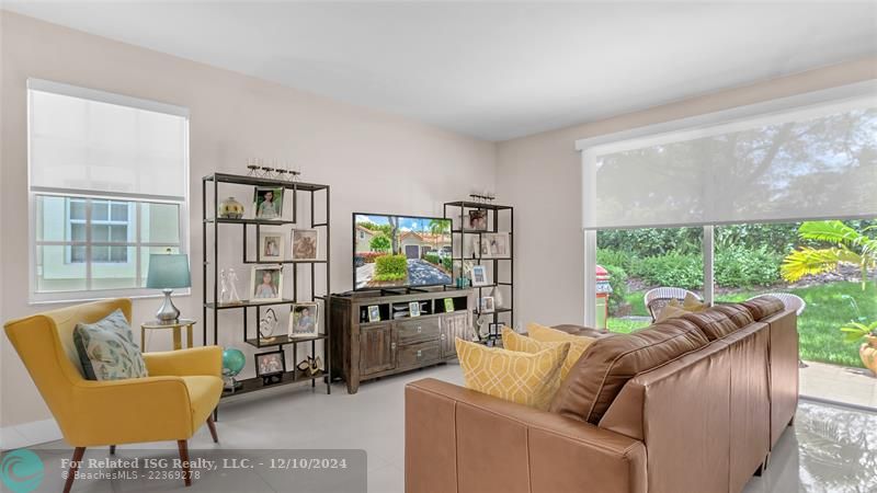 Granie snack counters and ample cabinets in this bright eat in kitchen