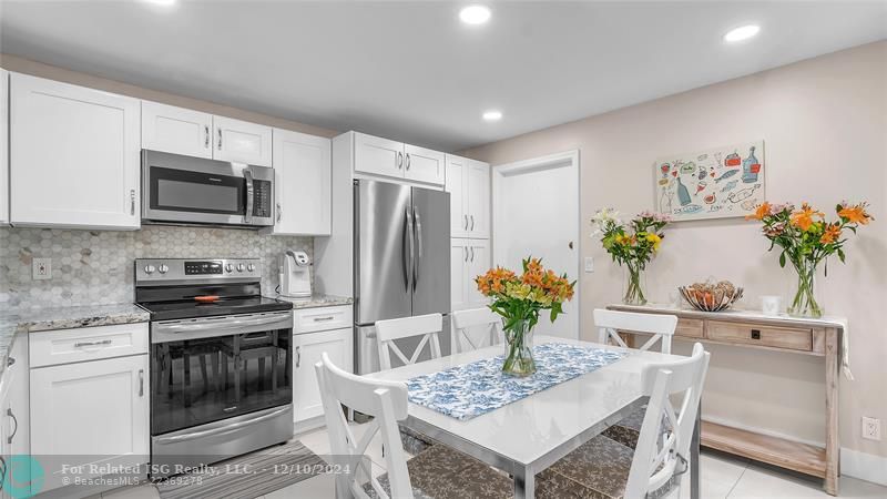 Stunning eat in kitchen with granite counters and SS appliances