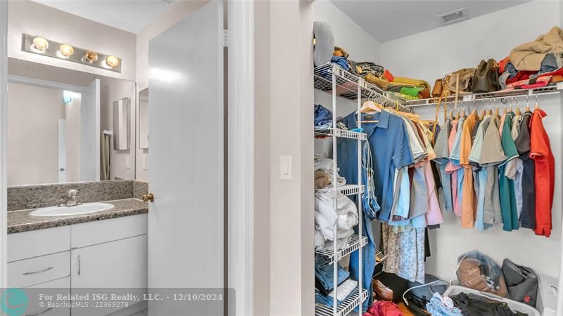 Granie snack counters and ample cabinets in this bright eat in kitchen