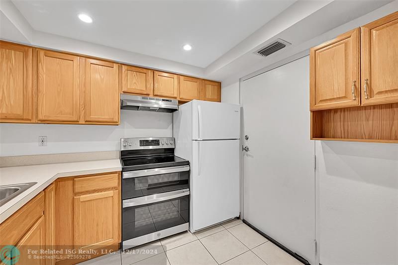 Virtually staged - cabinets are beige.