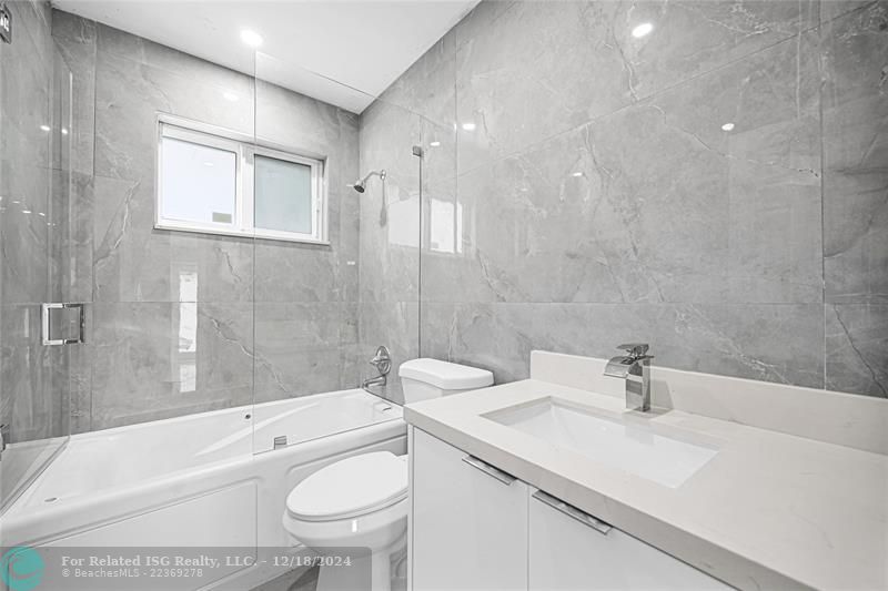 The main remodeled bathroom with jacuzzi. on the north side of the house.