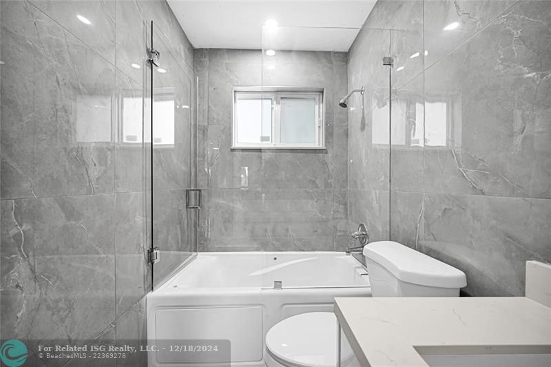 The main remodeled bathroom with jacuzzi. on the north side of the house.