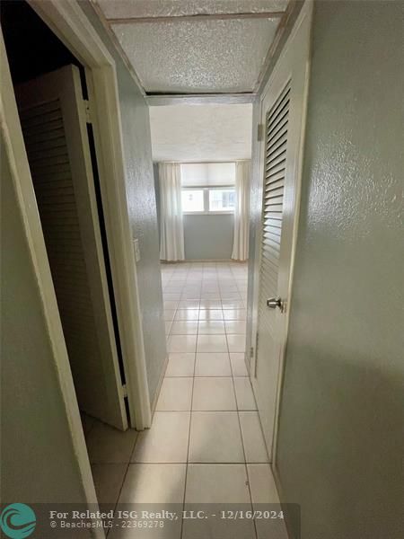 Hallway in bedroom to closets