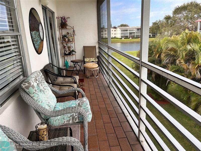 Large, Screened, Covered Balcony with Tropical water view