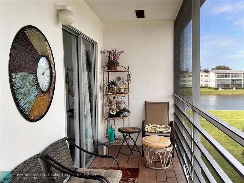 Large, Screened, Covered Balcony with Tropical water view