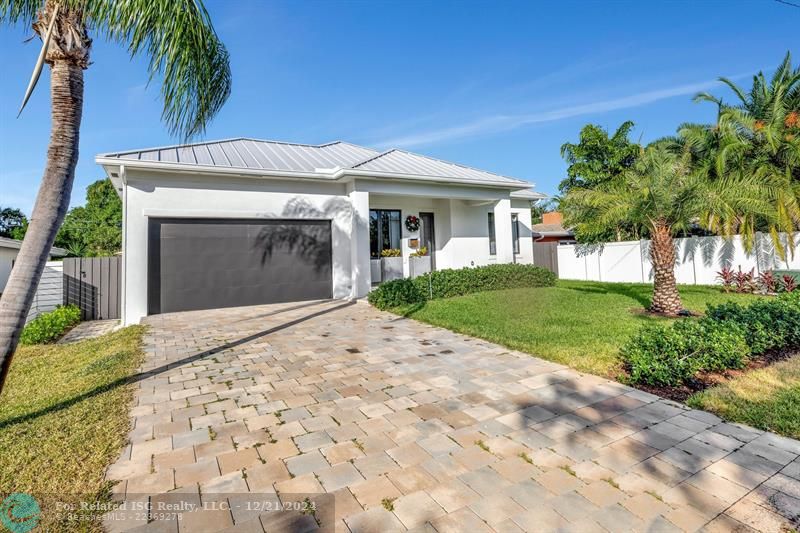 Paver driveway with 2 car garage.