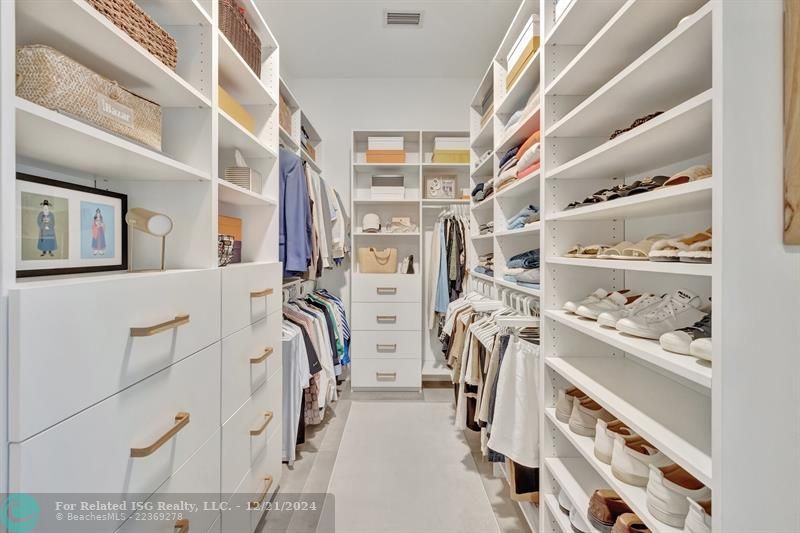 Primary bedroom walk-in closet.