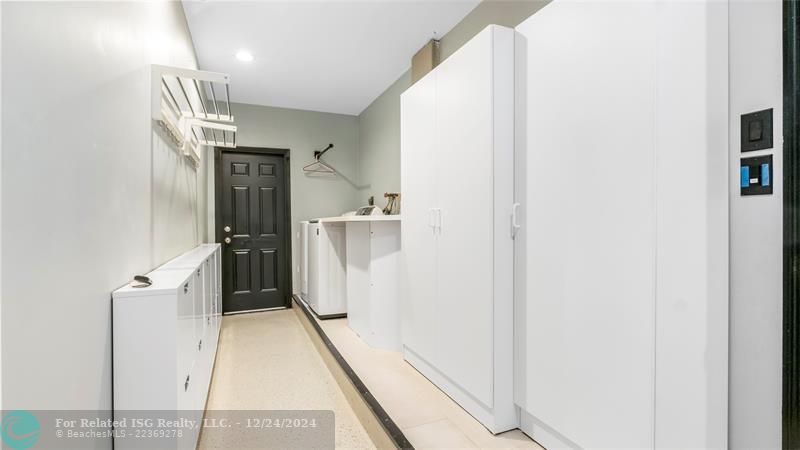 Huge inside laundry room with lots of extra storage!