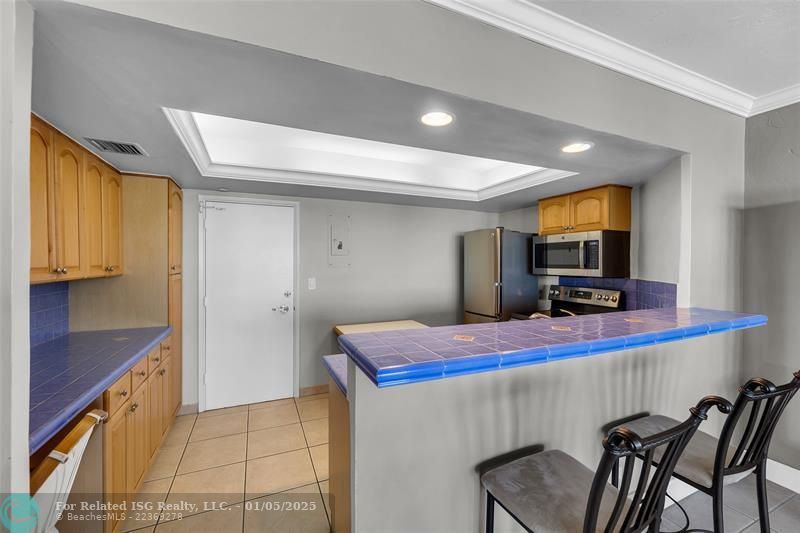 Tray Ceiling with Recessed Lighting in Kitchen