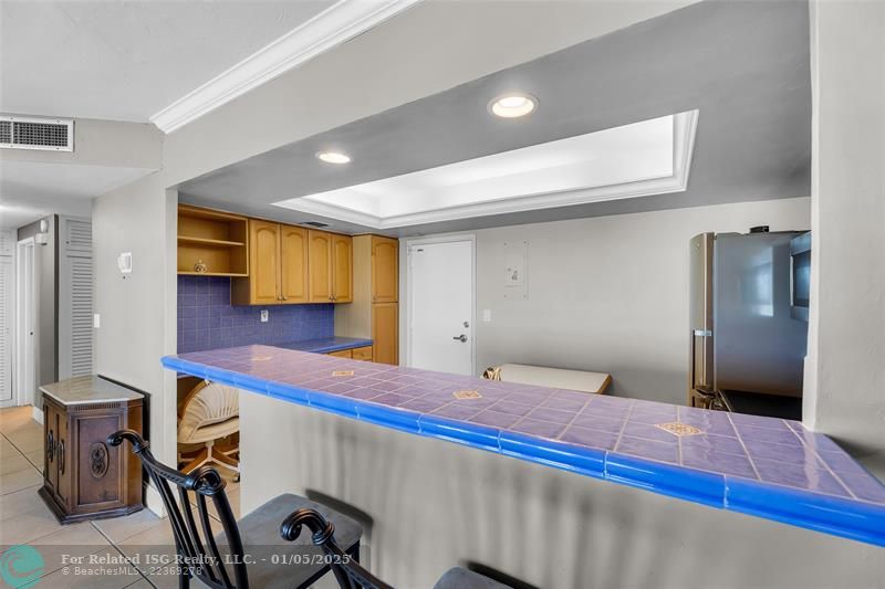 Tray Ceiling with Recessed Lighting in Kitchen